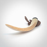 Hand carved Boars Tusk pendant with Buffalo horn, Mother of Pearl and Brass. Engraved large boars tusk pendant. Unisex necklace hand carved by Andrew Doughty here in New Zealand. Unique art to wear. Delivered with an adjustable brown cord.